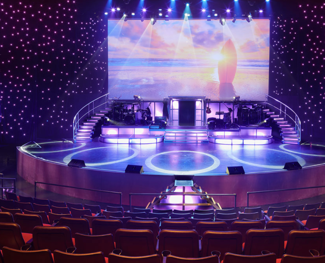 The Royal Hawaiian Theater stage - tiered indoor venue with full lighting rig