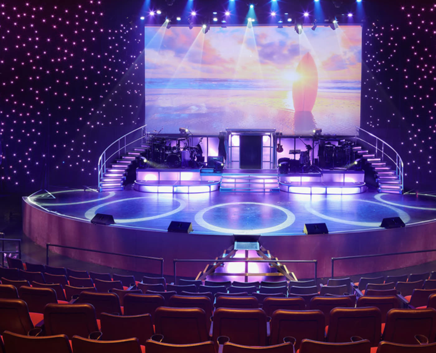 The Royal Hawaiian Theater stage - tiered indoor venue with full lighting rig